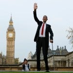 The world’s shortest man Chandra Bahadur Dangi poses with the tallest living man Sultan Kosen to mark the Guinness World Records Day in London
