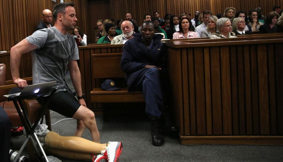 Paralympic gold medalist Oscar Pistorius prepares to walk across the courtroom without his prosthetic legs during the third day of the resentencing hearing for the 2013 murder of his girlfriend Reeva Steenkamp, at Pretoria High Court, South Africa June 15, 2016. REUTERS/Siphiwe Sibeko