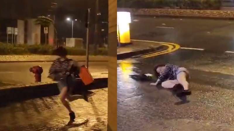 Mujer arrastrada por vientos en Hong Kong