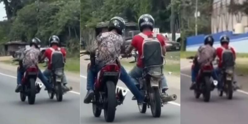 Captan a dos motociclistas conversando mientras se conducen por las calles de Villanueva, Cortes