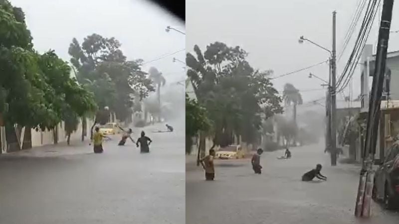 niños juegan calle inundada La Ceiba