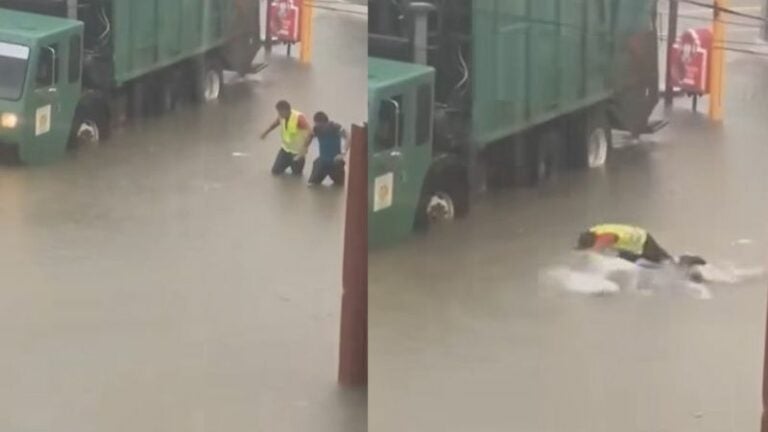 Hombres nada en las calles inundadas de cortés