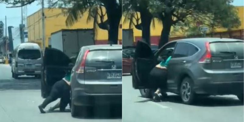 Mujer queda tirada tras forcejear con puerta de vehículo en SPS 